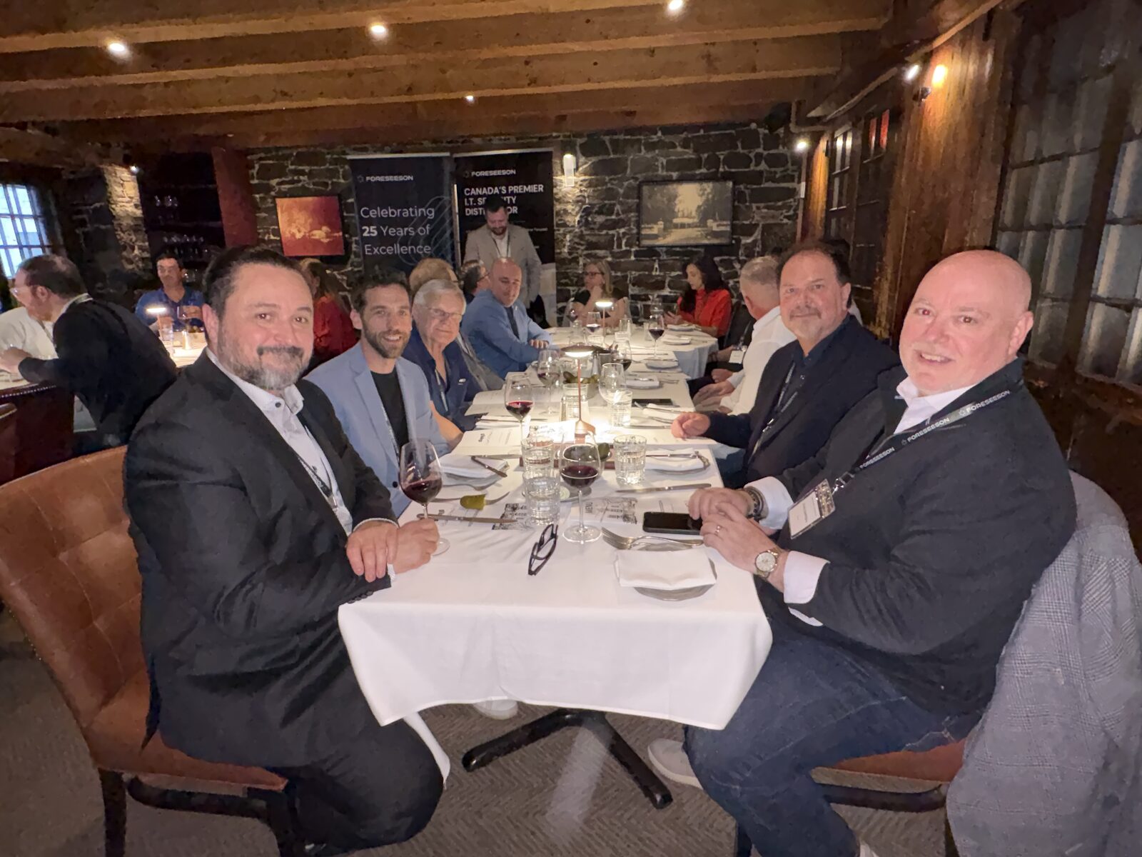 Partners around the dinner table at a Foreseeson partner event